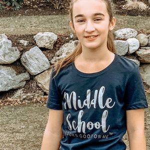 girl wearing navy blue middle school looks good on me t-shirt