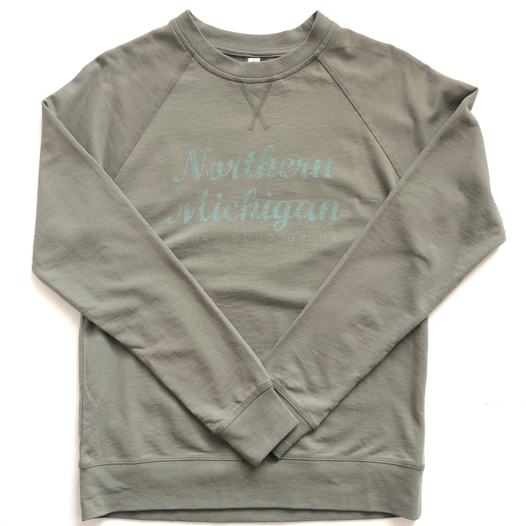 front of military green northern Michigan looks good on me long sleeve shirt with light green letters 