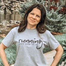 Load image into Gallery viewer, woman wearing running looks good on me performace tee.  Grey with black lettering.